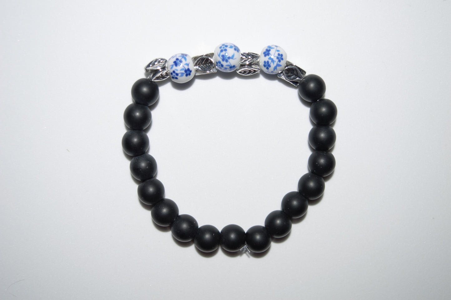 Flower ceramic and black stone bead bracelet