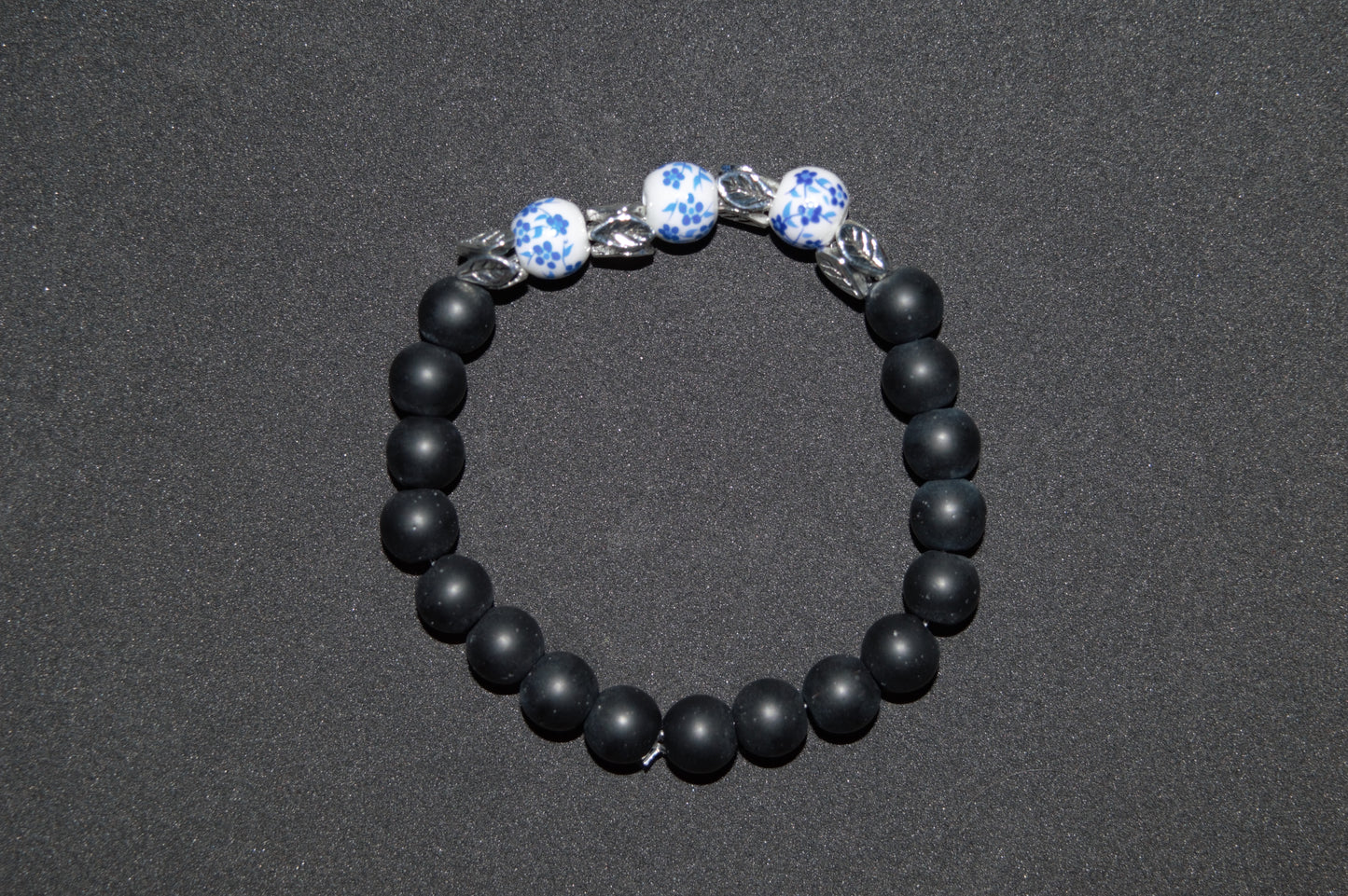 Flower ceramic and black stone bead bracelet